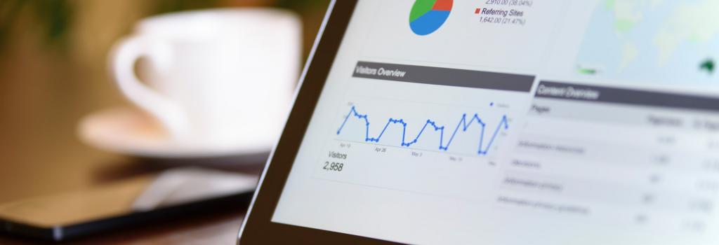 Black tablet computer on desk showing Google analytics for SEO in Ottawa